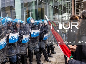 During a student march, a clash occurs in front of the Polytechnic University in Turin, Italy, on December 13, 2024. The students attempt to...