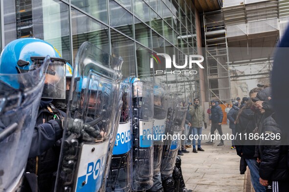 During a student march, a clash occurs in front of the Polytechnic University in Turin, Italy, on December 13, 2024. The students attempt to...