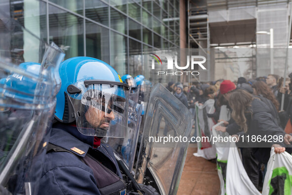 During a student march, a clash occurs in front of the Polytechnic University in Turin, Italy, on December 13, 2024. The students attempt to...