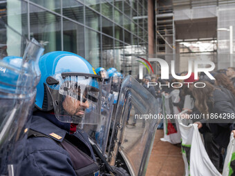 During a student march, a clash occurs in front of the Polytechnic University in Turin, Italy, on December 13, 2024. The students attempt to...