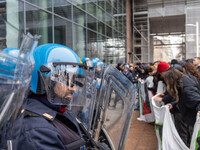 During a student march, a clash occurs in front of the Polytechnic University in Turin, Italy, on December 13, 2024. The students attempt to...