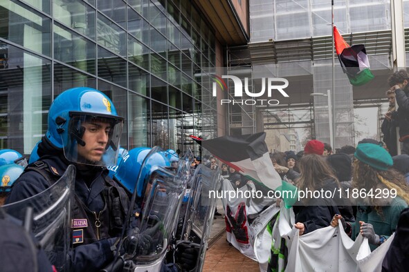 During a student march, a clash occurs in front of the Polytechnic University in Turin, Italy, on December 13, 2024. The students attempt to...