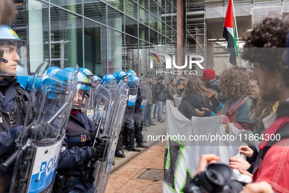 During a student march, a clash occurs in front of the Polytechnic University in Turin, Italy, on December 13, 2024. The students attempt to...