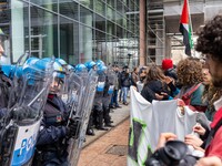 During a student march, a clash occurs in front of the Polytechnic University in Turin, Italy, on December 13, 2024. The students attempt to...