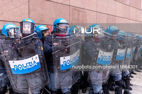 During a student march, a clash occurs in front of the Polytechnic University in Turin, Italy, on December 13, 2024. The students attempt to...