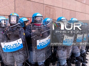 During a student march, a clash occurs in front of the Polytechnic University in Turin, Italy, on December 13, 2024. The students attempt to...