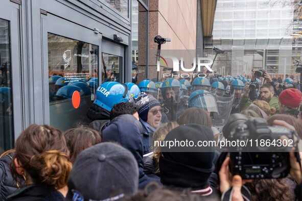 During a student march, a clash occurs in front of the Polytechnic University in Turin, Italy, on December 13, 2024. The students attempt to...