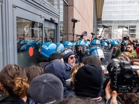 During a student march, a clash occurs in front of the Polytechnic University in Turin, Italy, on December 13, 2024. The students attempt to...