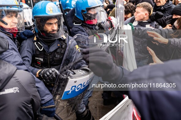 During a student march, a clash occurs in front of the Polytechnic University in Turin, Italy, on December 13, 2024. The students attempt to...