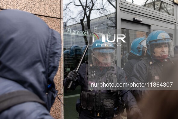 During a student march, a clash occurs in front of the Polytechnic University in Turin, Italy, on December 13, 2024. The students attempt to...