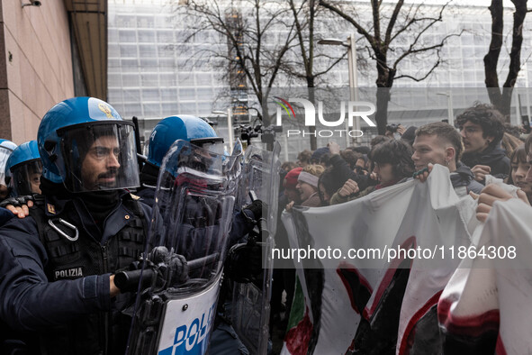 During a student march, a clash occurs in front of the Polytechnic University in Turin, Italy, on December 13, 2024. The students attempt to...