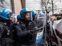 During a student march, a clash occurs in front of the Polytechnic University in Turin, Italy, on December 13, 2024. The students attempt to...