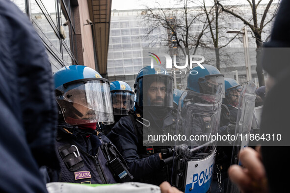 During a student march, a clash occurs in front of the Polytechnic University in Turin, Italy, on December 13, 2024. The students attempt to...