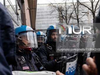 During a student march, a clash occurs in front of the Polytechnic University in Turin, Italy, on December 13, 2024. The students attempt to...