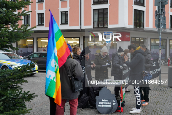 Women in Black hold a vigil at Gartnerplatz in Munich, Bavaria, Germany, on December 13, 2024, advocating for justice and peace in the Middl...