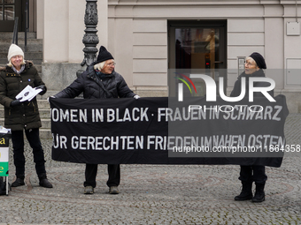 Women in Black hold a vigil at Gartnerplatz in Munich, Bavaria, Germany, on December 13, 2024, advocating for justice and peace in the Middl...