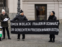 Women in Black hold a vigil at Gartnerplatz in Munich, Bavaria, Germany, on December 13, 2024, advocating for justice and peace in the Middl...