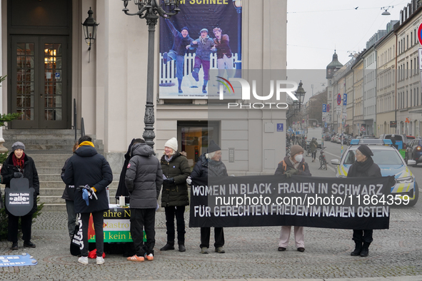 Women in Black hold a vigil at Gartnerplatz in Munich, Bavaria, Germany, on December 13, 2024, advocating for justice and peace in the Middl...