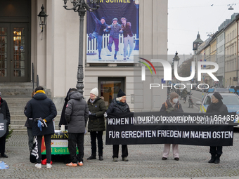 Women in Black hold a vigil at Gartnerplatz in Munich, Bavaria, Germany, on December 13, 2024, advocating for justice and peace in the Middl...