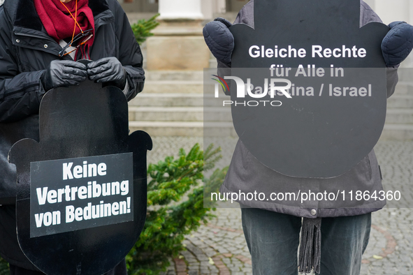 Women in Black hold a vigil at Gartnerplatz in Munich, Bavaria, Germany, on December 13, 2024, advocating for justice and peace in the Middl...