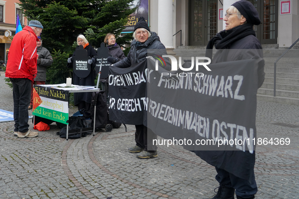 Women in Black hold a vigil at Gartnerplatz in Munich, Bavaria, Germany, on December 13, 2024, advocating for justice and peace in the Middl...