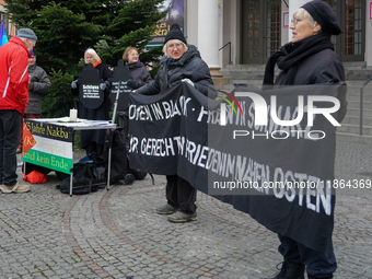 Women in Black hold a vigil at Gartnerplatz in Munich, Bavaria, Germany, on December 13, 2024, advocating for justice and peace in the Middl...