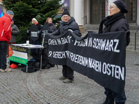 Women in Black hold a vigil at Gartnerplatz in Munich, Bavaria, Germany, on December 13, 2024, advocating for justice and peace in the Middl...