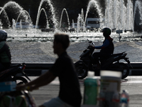 A rider crosses the road during clear weather in Jakarta, Indonesia, on December 12, 2024. The Regional Disaster Management Agency (BPBD) of...