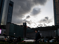 People cross the road following weather modification in Jakarta, Indonesia, on December 12, 2024. The Regional Disaster Management Agency (B...