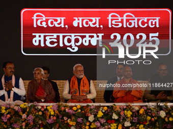 Indian Prime Minister Narendra Modi (C) and Uttar Pradesh Chief Minister Yogi Adityanath attend the inauguration of various development proj...