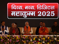 Indian Prime Minister Narendra Modi (C) and Uttar Pradesh Chief Minister Yogi Adityanath attend the inauguration of various development proj...