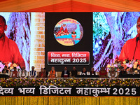 Indian Prime Minister Narendra Modi (C) and others attend the inauguration of various development projects for the '2025 Maha Kumbh mela' at...