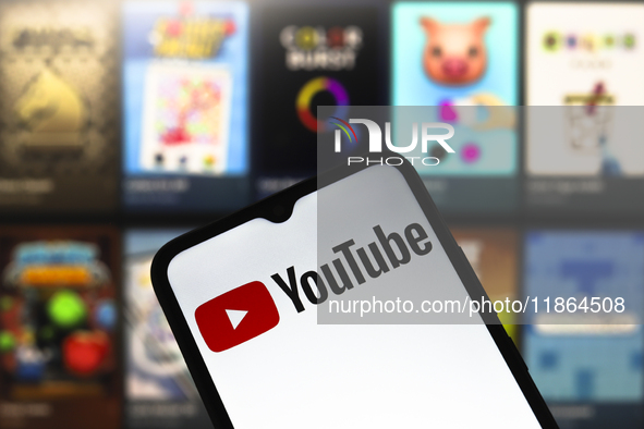 The YouTube logo appears on the screen of a smartphone in Reno, United States, on December 13, 2024. (Photo Illustration by Jaque Silva/NurP...