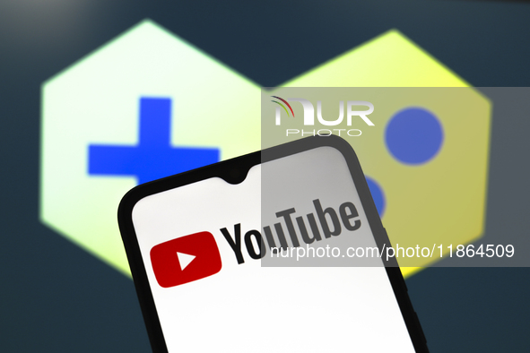 The YouTube logo appears on the screen of a smartphone in Reno, United States, on December 13, 2024. (Photo Illustration by Jaque Silva/NurP...