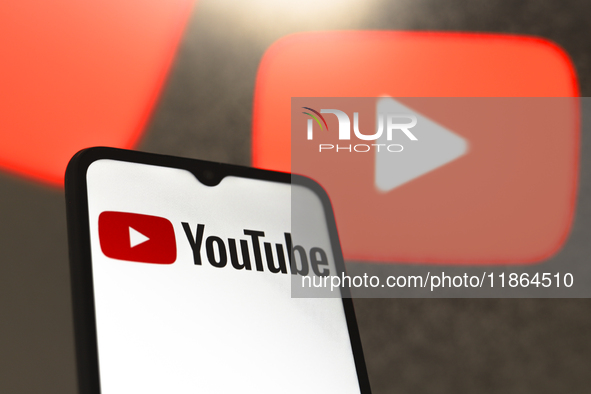 The YouTube logo appears on the screen of a smartphone in Reno, United States, on December 13, 2024. (Photo Illustration by Jaque Silva/NurP...