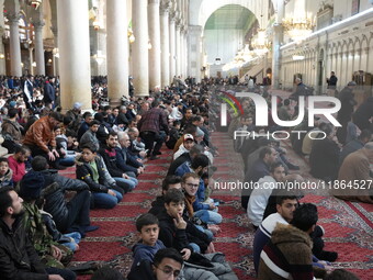 Syrians Perform The First Friday Prayer At The Umayyad Mosque In The Capital, Damascus, After The Fall Of The Assad Regime, on december 13,...