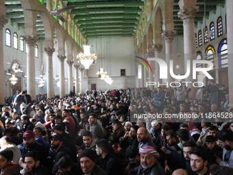 Syrians Perform The First Friday Prayer At The Umayyad Mosque In The Capital, Damascus, After The Fall Of The Assad Regime, on december 13,...