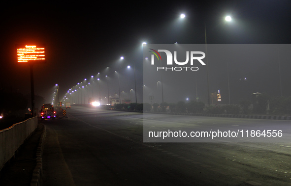 Street Lights Are Seen In The Fog Weather As Cold Waves Continues In The Eastern Parts Of India And Maximum Homeless People Are Facing Their...