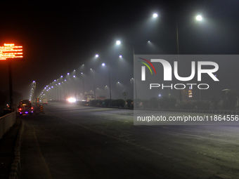 Street Lights Are Seen In The Fog Weather As Cold Waves Continues In The Eastern Parts Of India And Maximum Homeless People Are Facing Their...