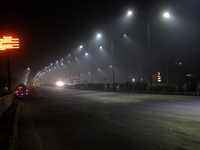 Street Lights Are Seen In The Fog Weather As Cold Waves Continues In The Eastern Parts Of India And Maximum Homeless People Are Facing Their...