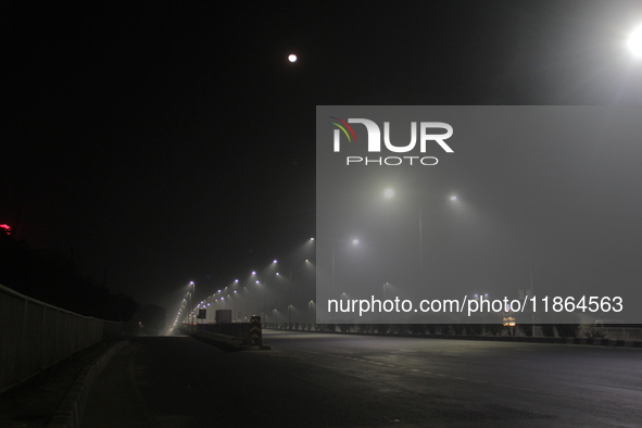 Street Lights Are Seen In The Fog Weather As Cold Waves Continues In The Eastern Parts Of India And Maximum Homeless People Are Facing Their...