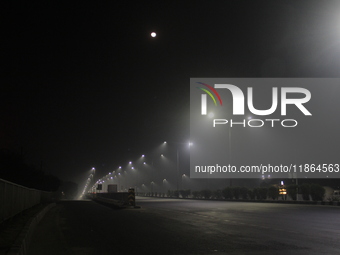 Street Lights Are Seen In The Fog Weather As Cold Waves Continues In The Eastern Parts Of India And Maximum Homeless People Are Facing Their...