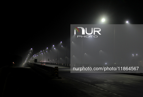 Street Lights Are Seen In The Fog Weather As Cold Waves Continues In The Eastern Parts Of India And Maximum Homeless People Are Facing Their...