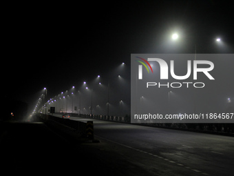 Street Lights Are Seen In The Fog Weather As Cold Waves Continues In The Eastern Parts Of India And Maximum Homeless People Are Facing Their...