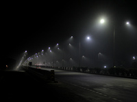 Street Lights Are Seen In The Fog Weather As Cold Waves Continues In The Eastern Parts Of India And Maximum Homeless People Are Facing Their...