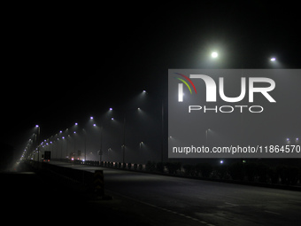 Street Lights Are Seen In The Fog Weather As Cold Waves Continues In The Eastern Parts Of India And Maximum Homeless People Are Facing Their...