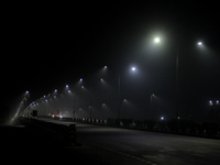 Street Lights Are Seen In The Fog Weather As Cold Waves Continues In The Eastern Parts Of India And Maximum Homeless People Are Facing Their...