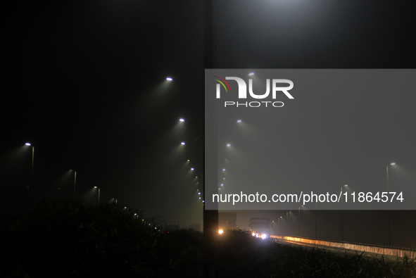 Street Lights Are Seen In The Fog Weather As Cold Waves Continues In The Eastern Parts Of India And Maximum Homeless People Are Facing Their...