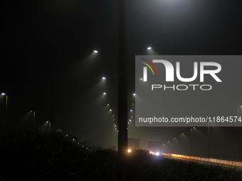 Street Lights Are Seen In The Fog Weather As Cold Waves Continues In The Eastern Parts Of India And Maximum Homeless People Are Facing Their...