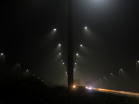 Street Lights Are Seen In The Fog Weather As Cold Waves Continues In The Eastern Parts Of India And Maximum Homeless People Are Facing Their...